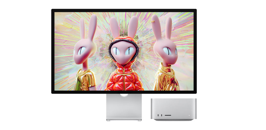 Mac Studio 和 Studio Display 并排放置，屏幕上展示三維人形兔形象圖片。